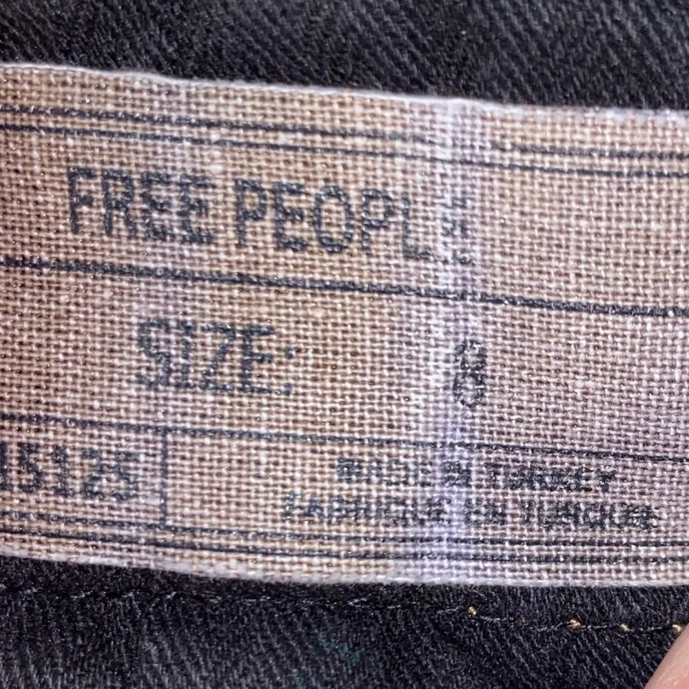 Free People distressed denim black mini skirt. Size 8